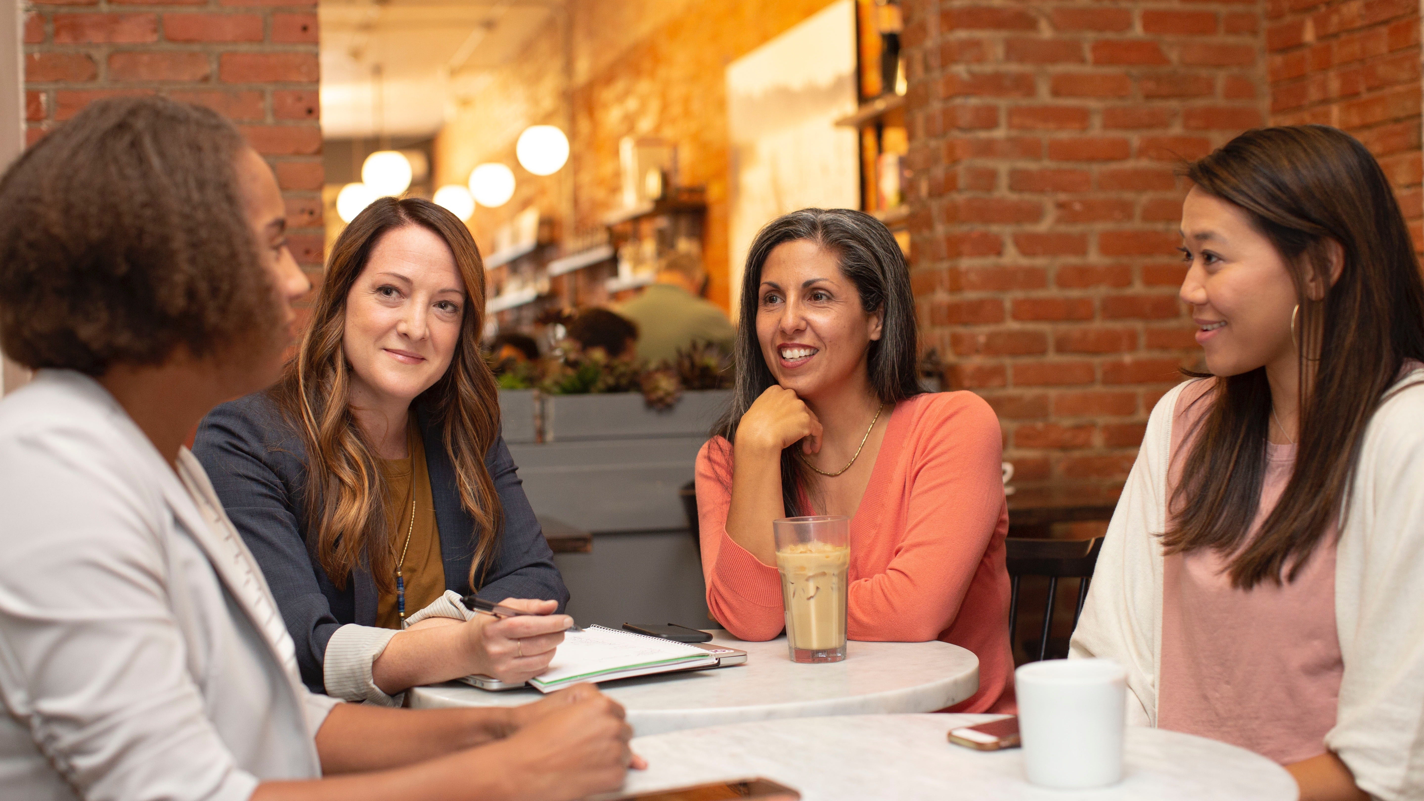 An image of a group of women in a cafe.